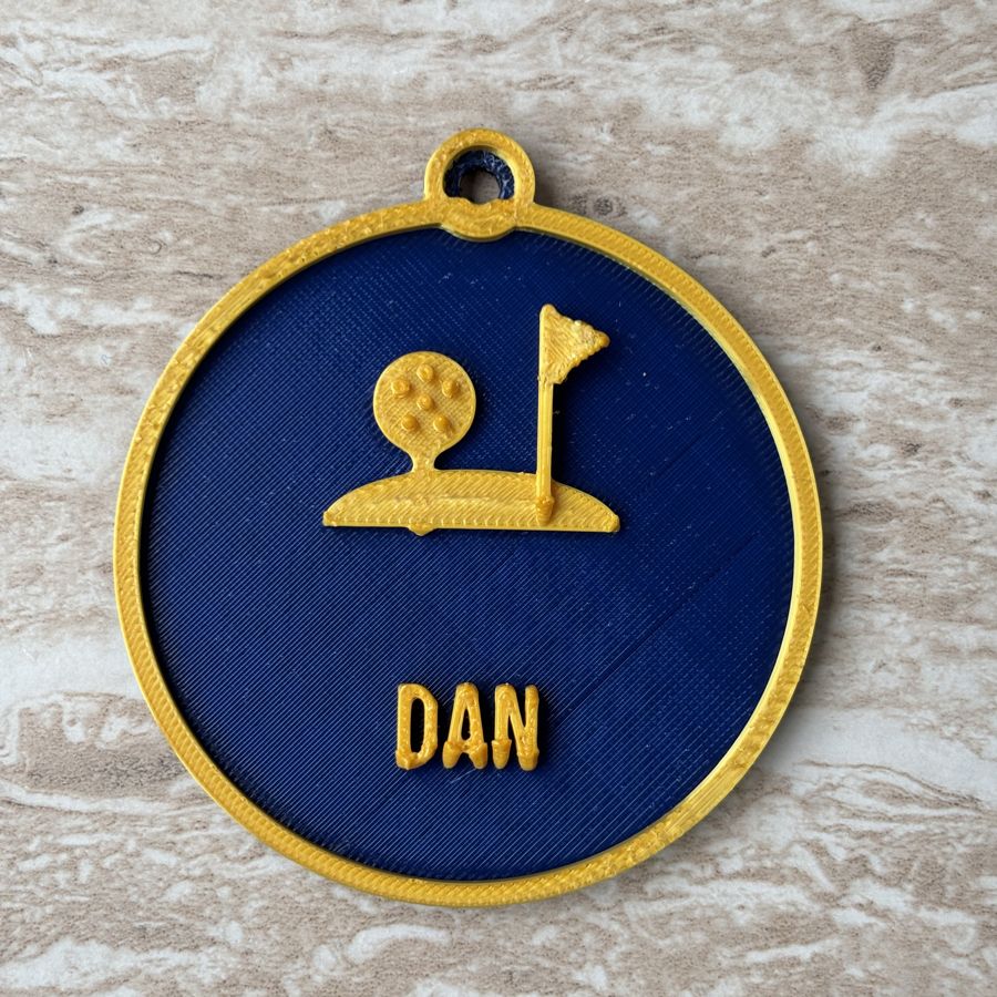 Personalised golf ornament with ball and flag and the name DAN