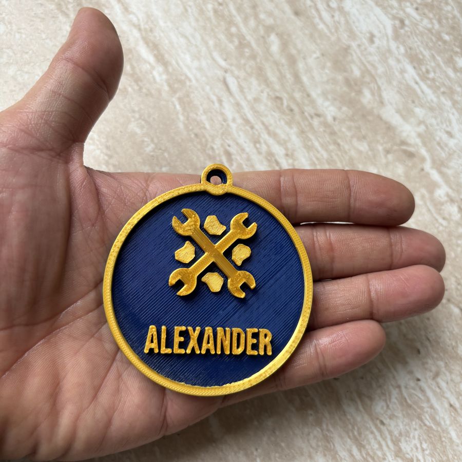 Personalised ornament held in a hand to show its size
